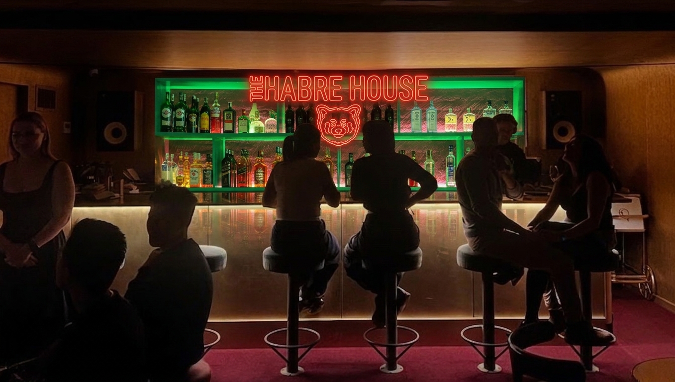Bar with neon Habre House sign