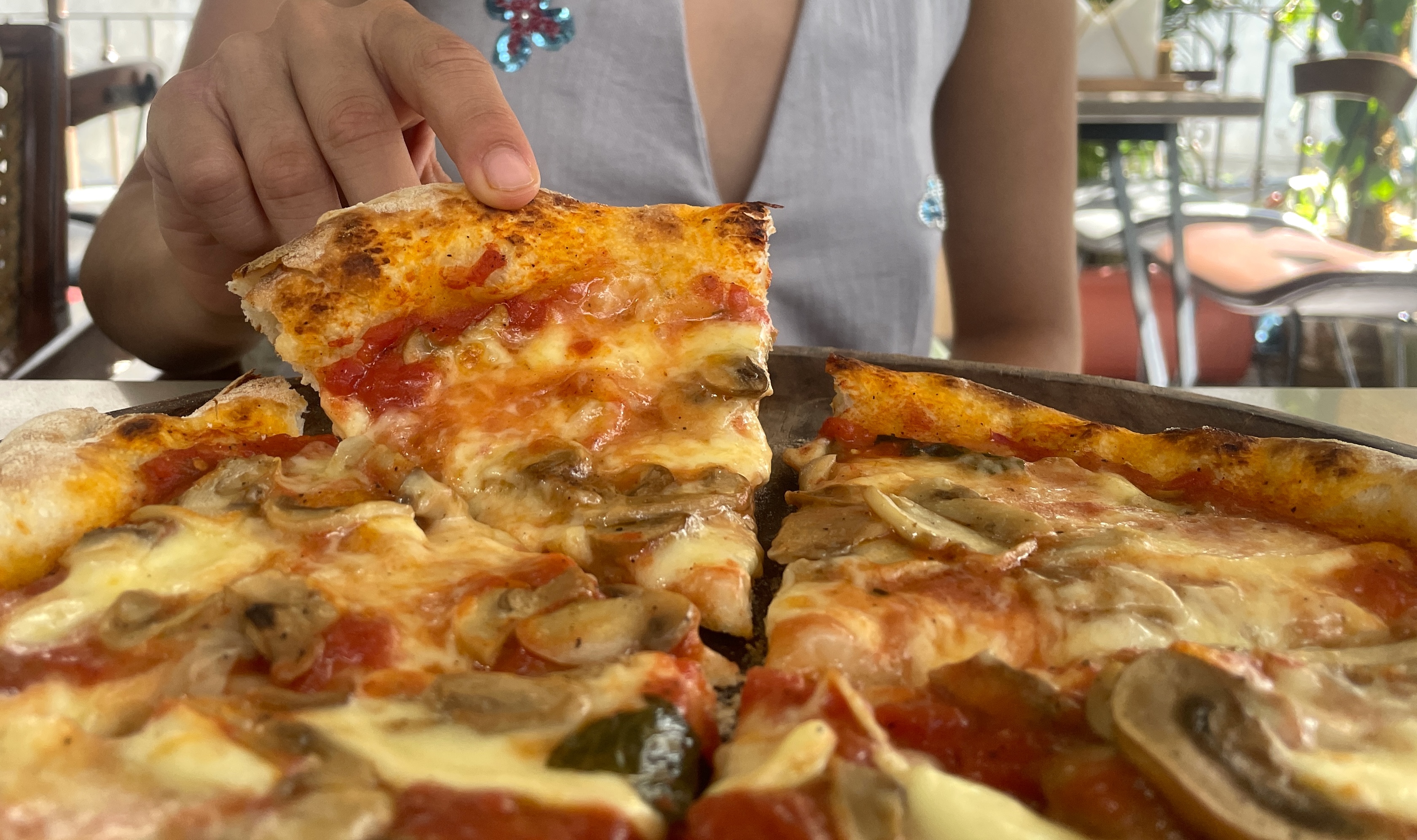 Slice of pizza being lifted